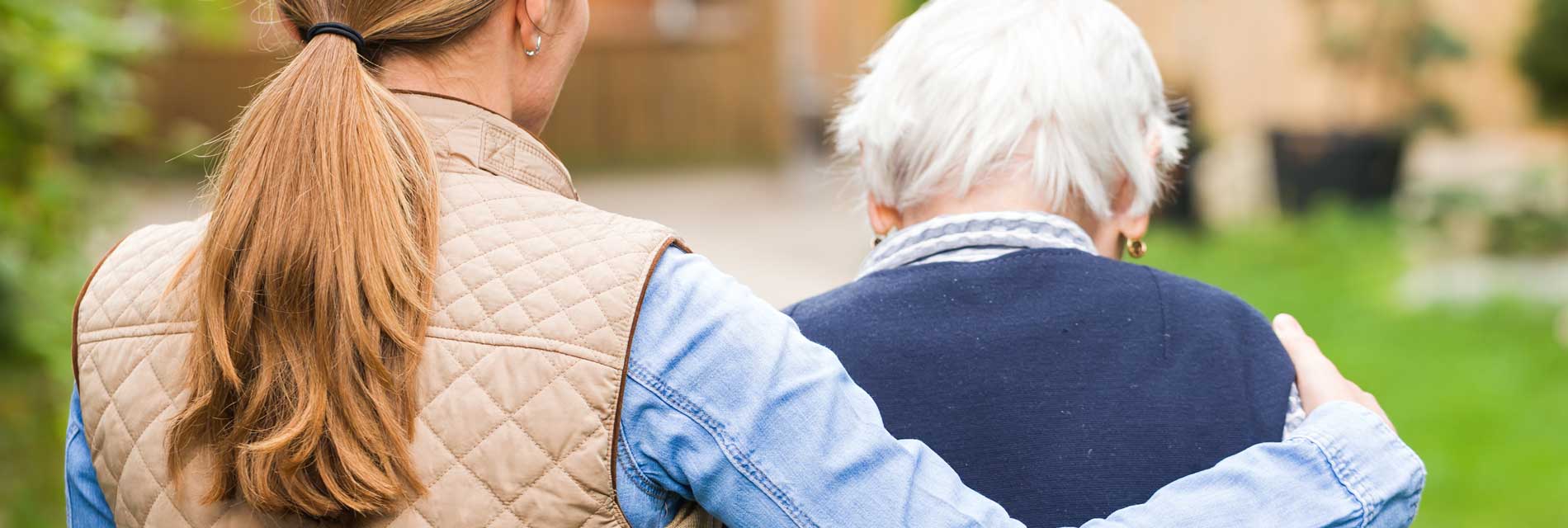 A carer looking after an elderly woman